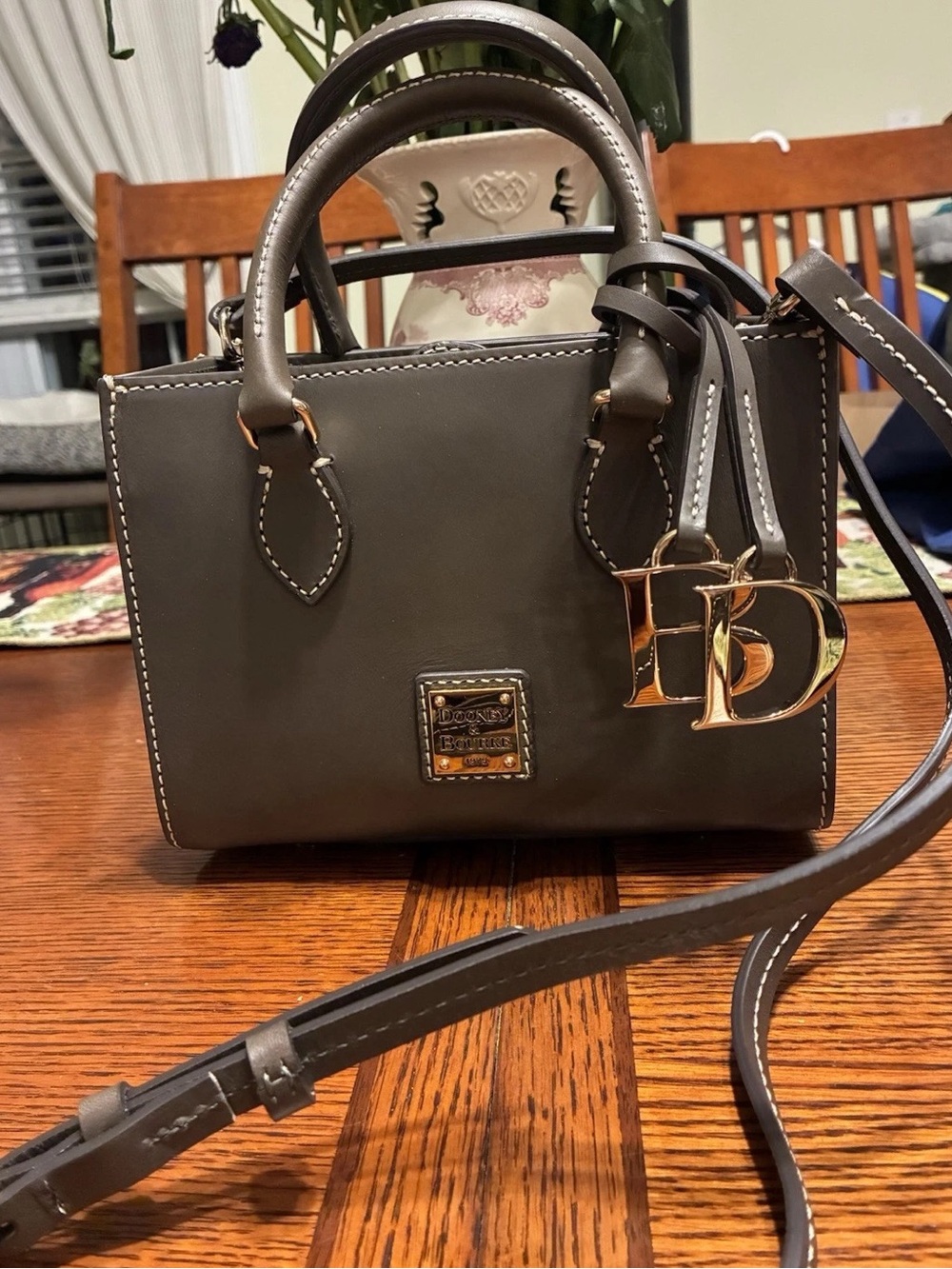 Dooney & Bourke Taupe Leather Satchel with Gold PD Charm. Adorable bag.